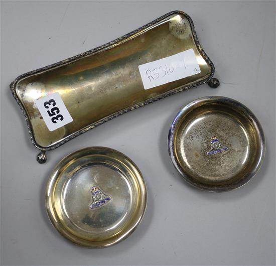 A pair of silver Royal Artillery dishes and a silver pin tray